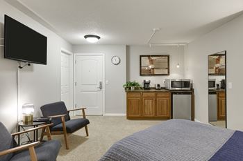 Kitchen area with bedroom
